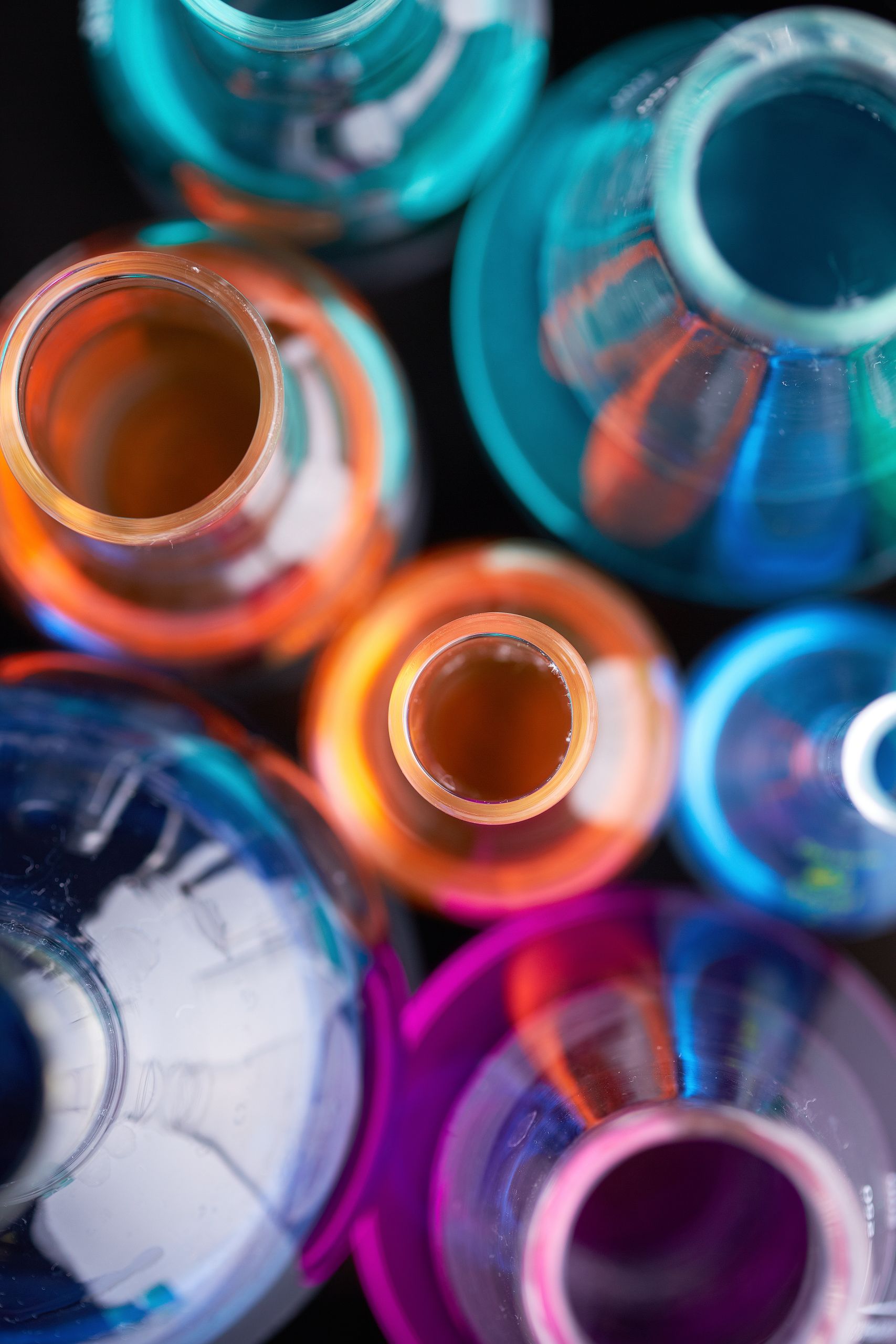 Image of several flasks with multi-color liquids